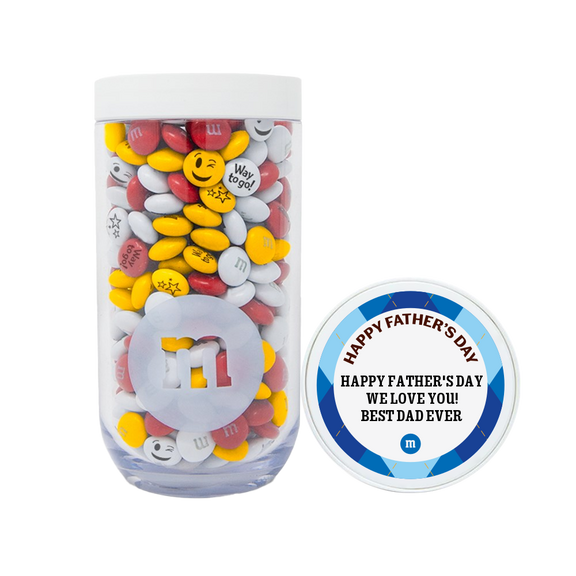 Clear jar with white lid containing M&M'S candies in yellow, red, and white with messages including "Way to go!" and emoji designs, with Father's Day label reading "HAPPY FATHER'S DAY WE LOVE YOU! BEST DAD EVER."